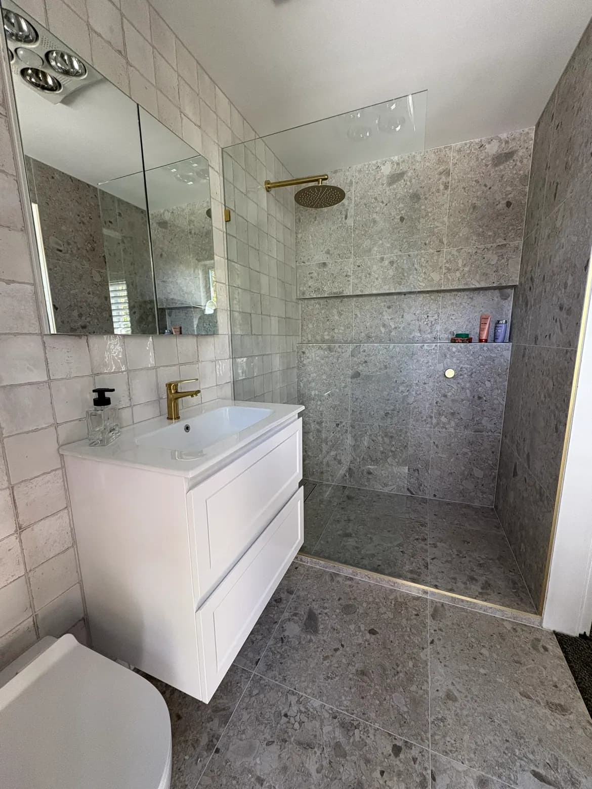 Renovated bathroom with a wall hung vanity