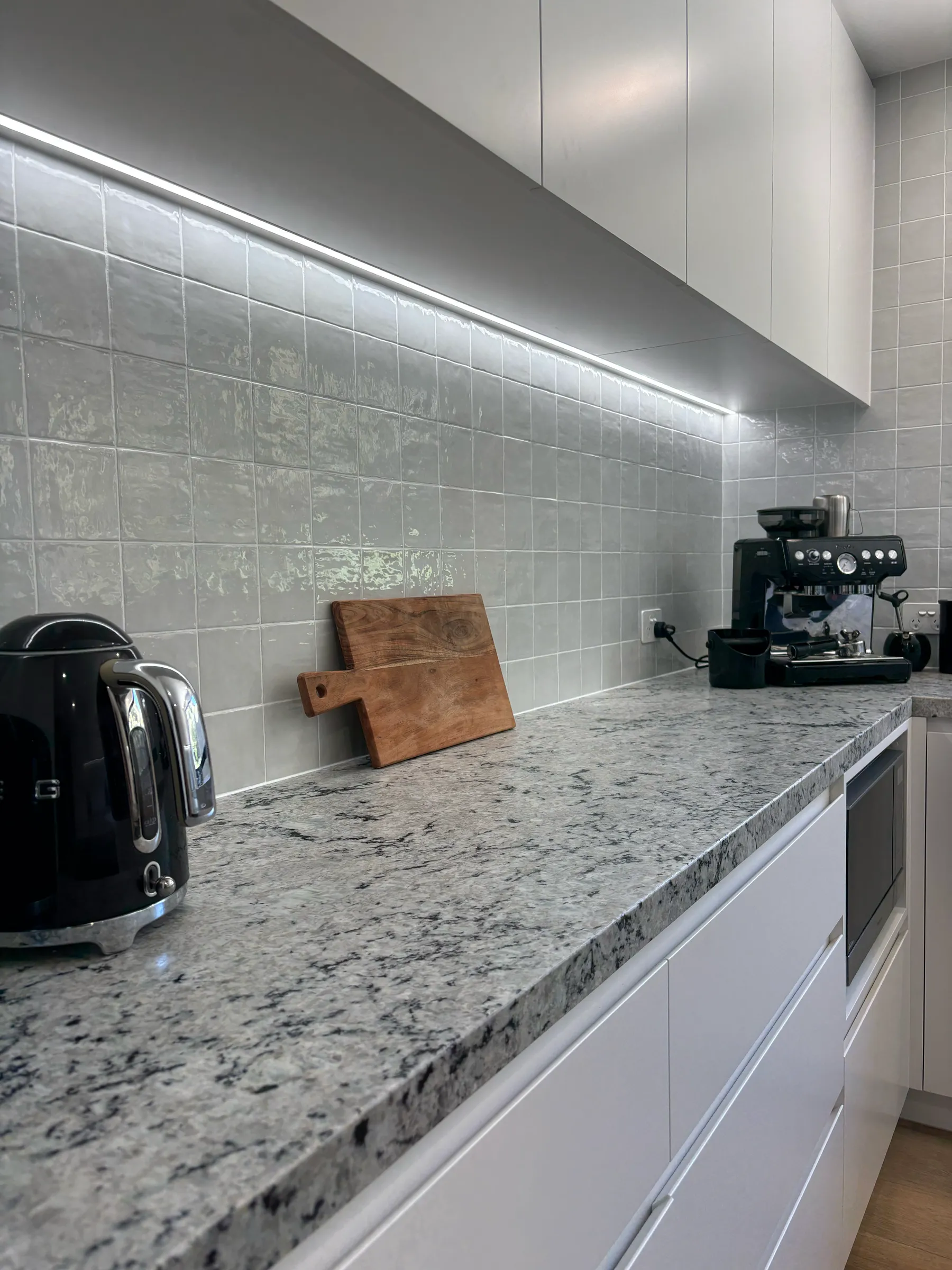 Stone kitchen benchtop with under cabinet lighting